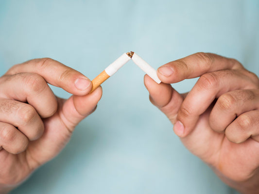 Breaking Cigarette In half with two hands