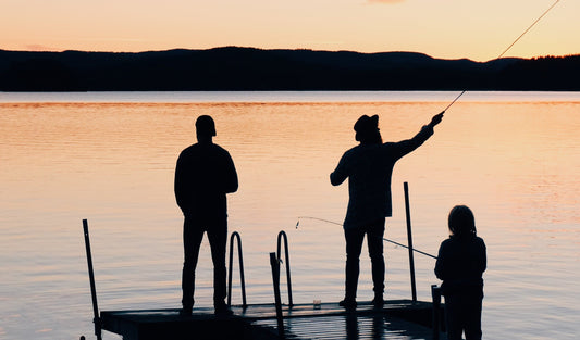 A family enjoying sunset at the river