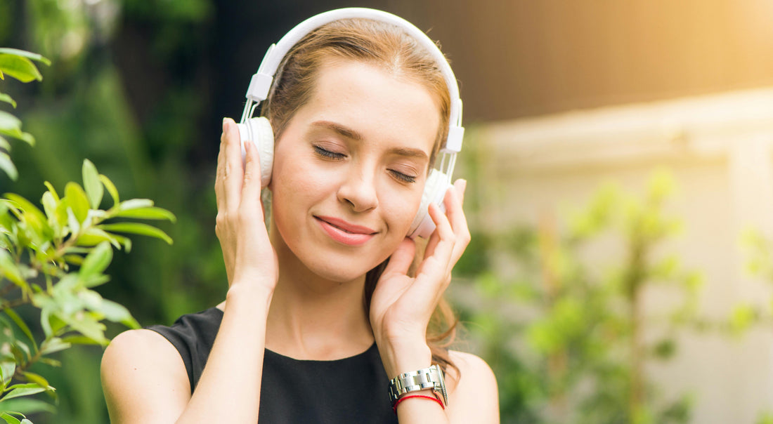 A girl listening Music In Headphones 