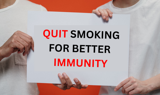 person holding a sign board "Quit Smoking For Better Immunity" Image