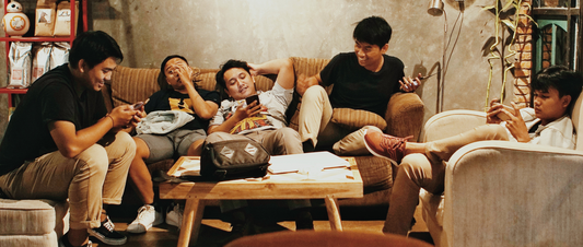 A group of people chilling in a room 
