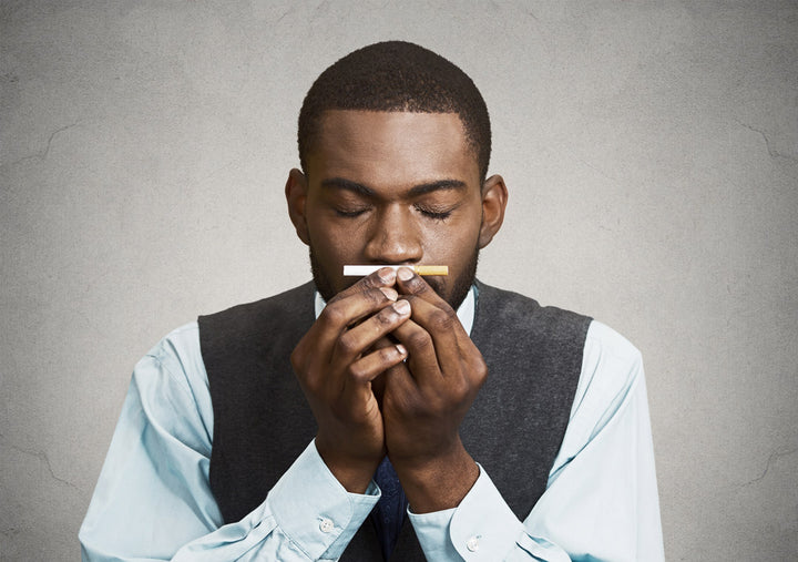 A man Smelling Cigarettes 