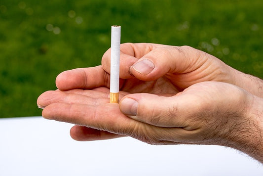 holding cigarettes in two hands