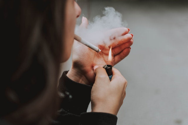 A women smoking a cigarette 