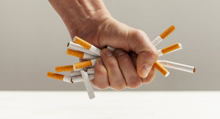 Crushing Cigarettes With Hands Stock Image 