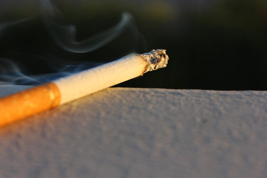 lit up cigarette in warm sunlight 