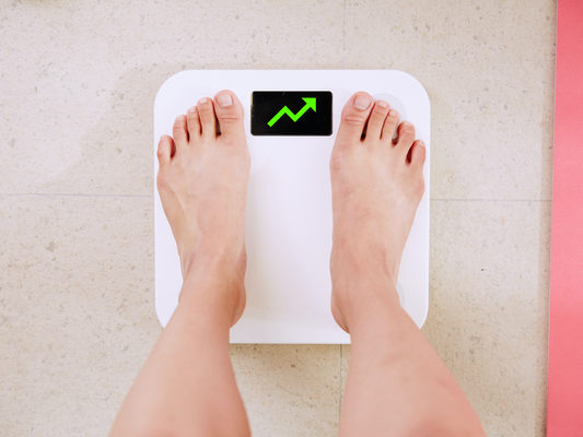 Person standing on a weight machine