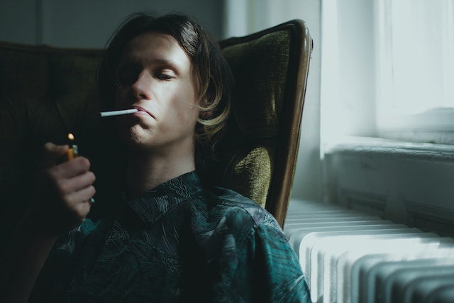 A man smoking Indoors 