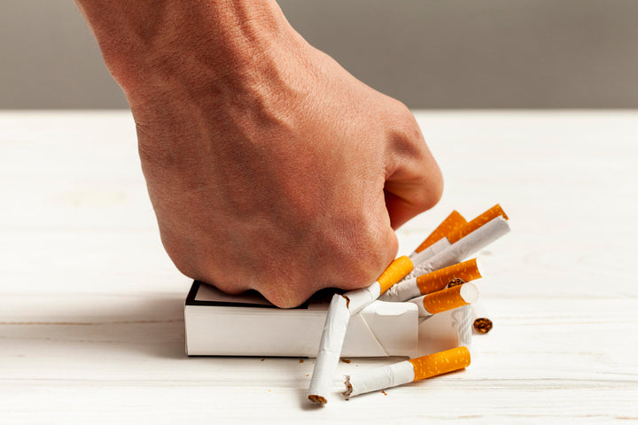 quitting smoking image of crushing cigarettes 