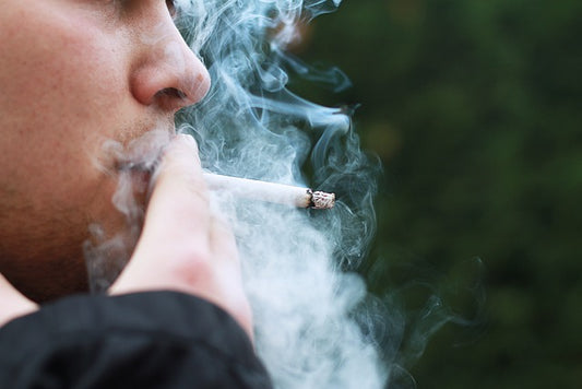 Smoking Cigarette and a lots of Smoking around face 