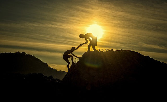 A person giving hands to other person