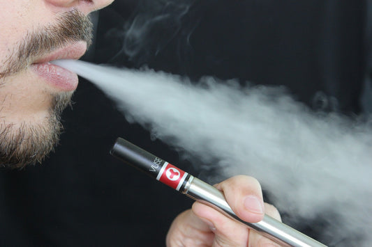 A person smoking a vape 